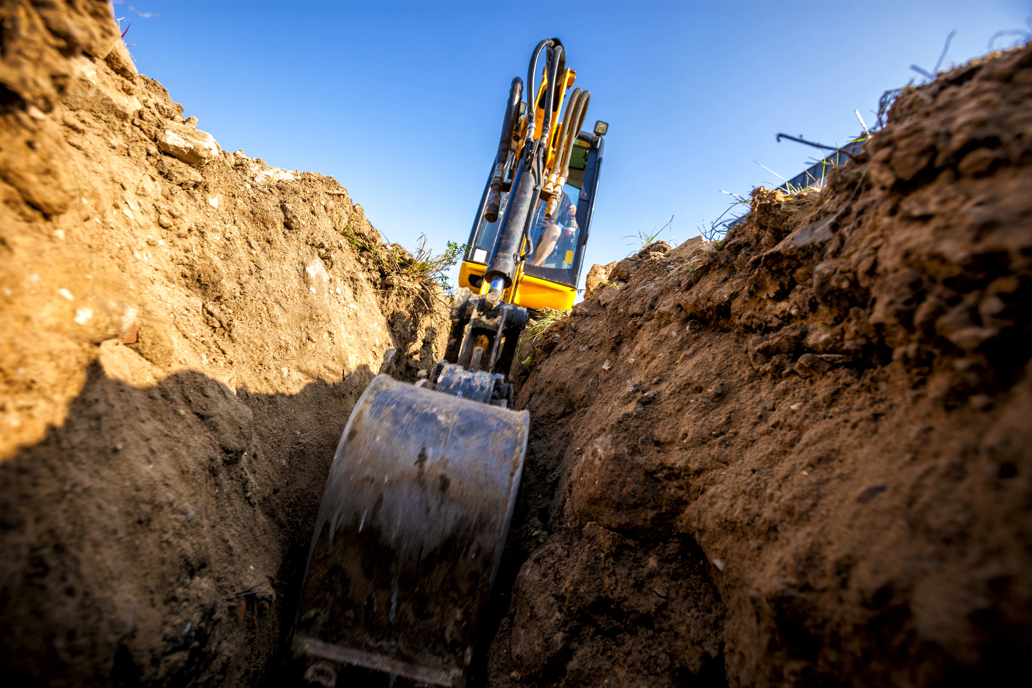 Digger in deep trench