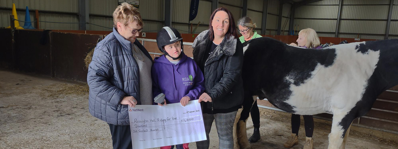 Doncaster team raise money fisher german banner